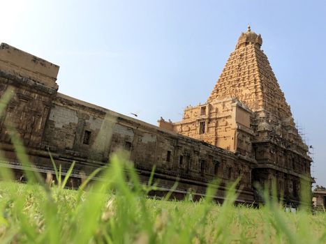The Brihadisvara temple or Brihadeeswar temple located in Thanjavur, Tamilnadu built by Tamil King Raja Raja Chola-I between 1003 and 1010 AD. This is the Hindu temple built in Dravidian architecture style. The temple is entirely built with granite stones and the temple contains many monolithic sculptures in it. This temple is one of the `Great Living Chola Temples` and also tamil words are inscribed in the wall of the temple. This temple is dedicated to Lord shiva and it is a UNESCO World Heritage Site.