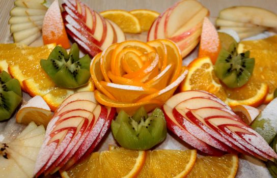 Vegetarian fruit salad of kiwi, orange, citrus and Apple. Vitamin Breakfast and fresh fruit salad for a healthy lifestyle.