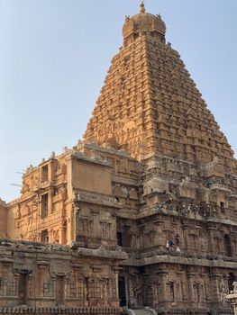 The Brihadisvara temple or Brihadeeswar temple located in Thanjavur, Tamilnadu built by Tamil King Raja Raja Chola-I between 1003 and 1010 AD. This is the Hindu temple built in Dravidian architecture style. The temple is entirely built with granite stones and the temple contains many monolithic sculptures in it. This temple is one of the `Great Living Chola Temples` and also tamil words are inscribed in the wall of the temple. This temple is dedicated to Lord shiva and it is a UNESCO World Heritage Site.