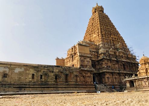 The Brihadisvara temple or Brihadeeswar temple located in Thanjavur, Tamilnadu built by Tamil King Raja Raja Chola-I between 1003 and 1010 AD. This is the Hindu temple built in Dravidian architecture style. The temple is entirely built with granite stones and the temple contains many monolithic sculptures in it. This temple is one of the `Great Living Chola Temples` and also tamil words are inscribed in the wall of the temple. This temple is dedicated to Lord shiva and it is a UNESCO World Heritage Site.