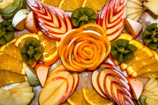 Fruit salad of kiwi, orange, citrus and Apple in vegetarian restaurant. Vitamin Breakfast and fresh fruit salad for a healthy lifestyle.