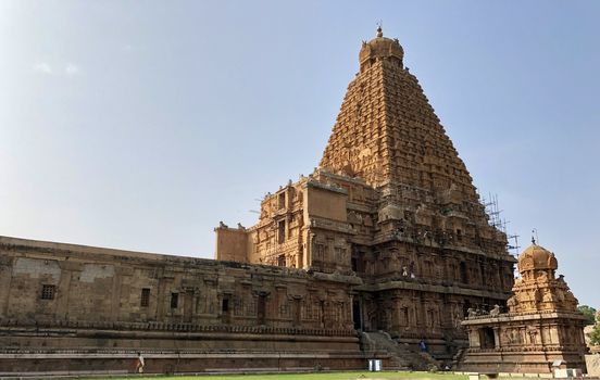 The Brihadisvara temple or Brihadeeswar temple located in Thanjavur, Tamilnadu built by Tamil King Raja Raja Chola-I between 1003 and 1010 AD. This is the Hindu temple built in Dravidian architecture style. The temple is entirely built with granite stones and the temple contains many monolithic sculptures in it. This temple is one of the `Great Living Chola Temples` and also tamil words are inscribed in the wall of the temple. This temple is dedicated to Lord shiva and it is a UNESCO World Heritage Site.