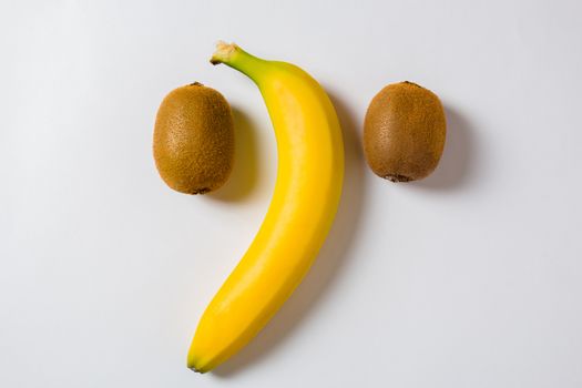 Banana with two kiwis on a white background. Fresh fruit, healthy and healthy diet Breakfast. Healthy food