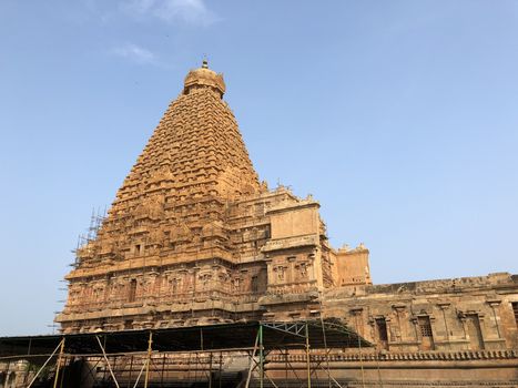 The Brihadisvara temple or Brihadeeswar temple located in Thanjavur, Tamilnadu built by Tamil King Raja Raja Chola-I between 1003 and 1010 AD. This is the Hindu temple built in Dravidian architecture style. The temple is entirely built with granite stones and the temple contains many monolithic sculptures in it. This temple is one of the `Great Living Chola Temples` and also tamil words are inscribed in the wall of the temple. This temple is dedicated to Lord shiva and it is a UNESCO World Heritage Site.