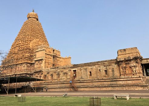 The Brihadisvara temple or Brihadeeswar temple located in Thanjavur, Tamilnadu built by Tamil King Raja Raja Chola-I between 1003 and 1010 AD. This is the Hindu temple built in Dravidian architecture style. The temple is entirely built with granite stones and the temple contains many monolithic sculptures in it. This temple is one of the `Great Living Chola Temples` and also tamil words are inscribed in the wall of the temple. This temple is dedicated to Lord shiva and it is a UNESCO World Heritage Site.