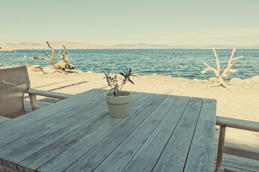 Empty restaurant by the Aegean sea and cruise boat, travel and nature, scene