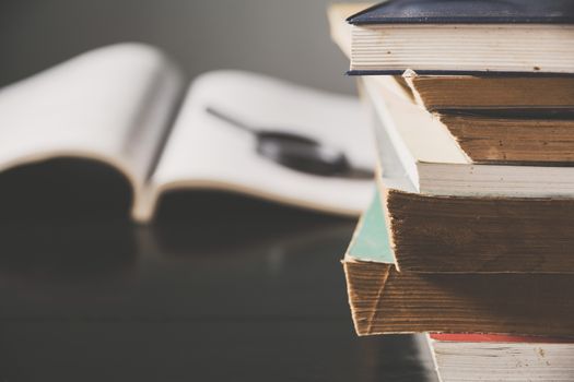 The pile of old books on the table. Education and object concept.