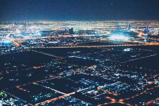 Aerial night view of Dubai in United Arab Emirates, metropolitan cityscape scenery