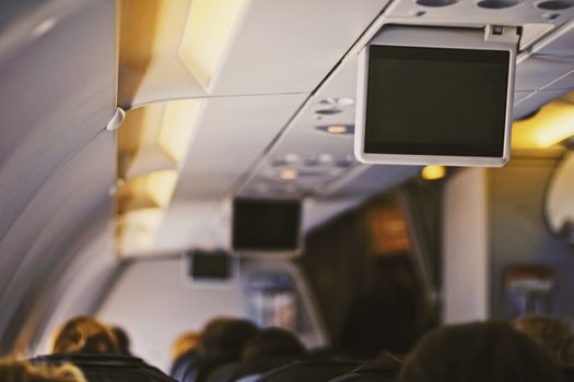 Tv screen in the airplane, travel and telecommunication concept