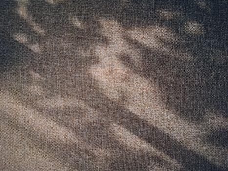 Linen texture and shadows as rustic background, fabric and material