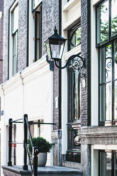 Architectural detail of a building on the main city center street of Amsterdam in Netherlands, european architecture