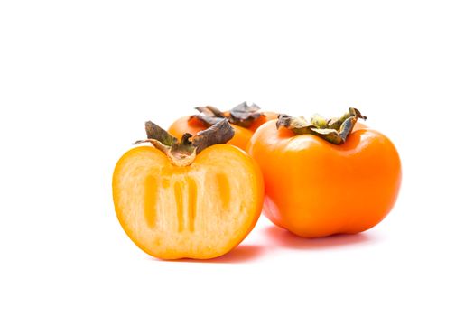 Delicious fresh persimmon fruit isolated on white background.