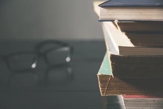 The pile of old books on the table. Education and object concept.