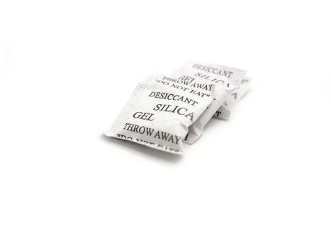 Silica gel packets isolated on a white background.