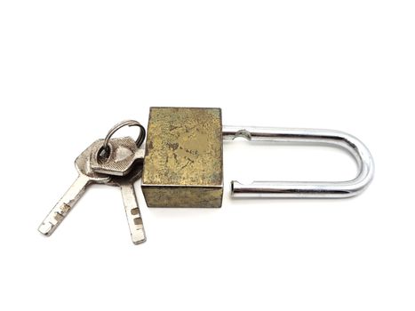 Keys stuck in a old lock isolated on a white background.