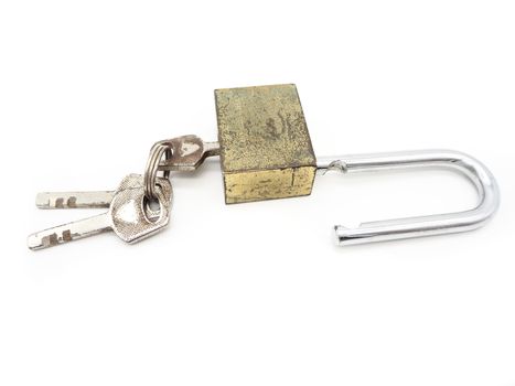 Keys stuck in a old lock isolated on a white background.