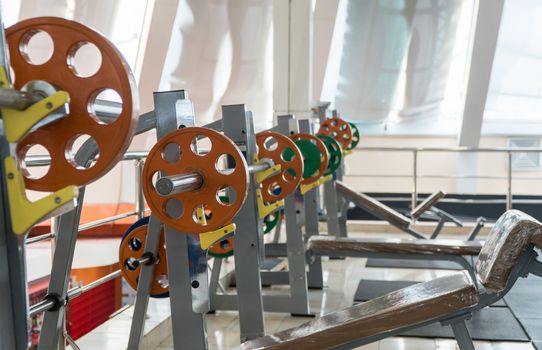 sports equipment and barbells in the gym