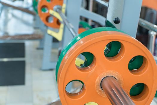 sports equipment and barbells in the gym, close-up