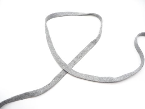 A grey fabric rope isolated on a white background.