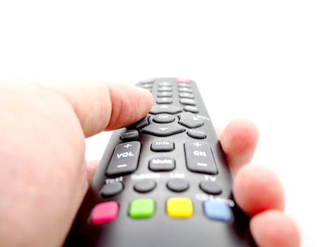 Hand holding a remote control TV isolated on white background.