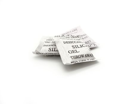 Silica gel packets isolated on a white background.