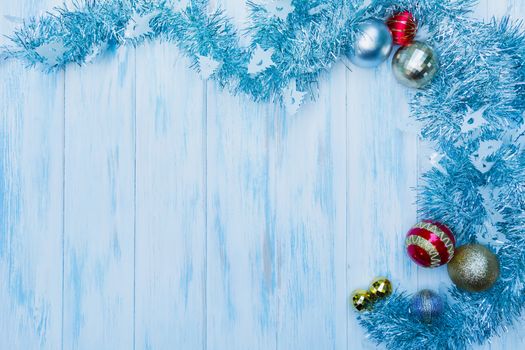Christmas and new year accessory with copy space on blue wooden background.