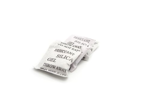 Silica gel packets isolated on a white background.