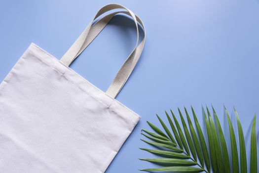 White tote bag canvas fabric. Cloth shopping sack mockup with copy space.