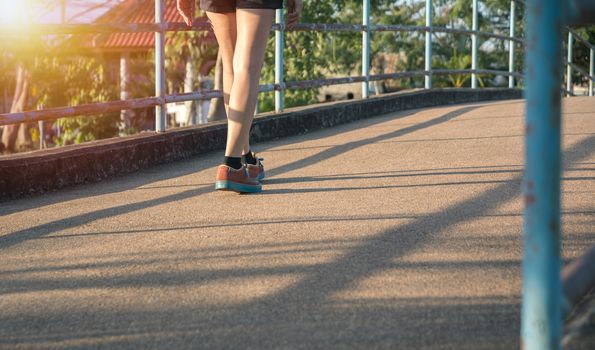 A woman running at the morning for jogging, exercising and healthy lifestyle concept.