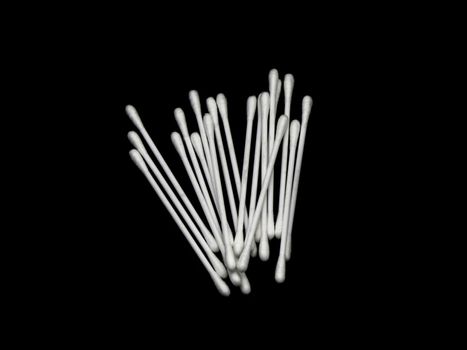 A white cotton buds. Cotton buds group isolated on black background.