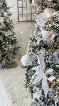 composition of Christmas decorations with fir tree and garlands. the sparkling lights