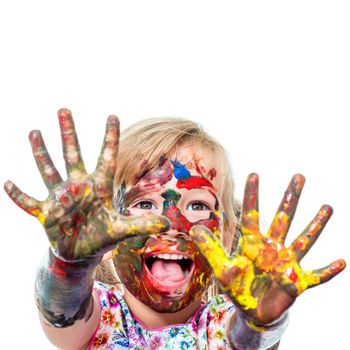 Close up portrait of shouting Little Girl messed with color paint.Infant showing hands covered with paint. Isolated on white background.