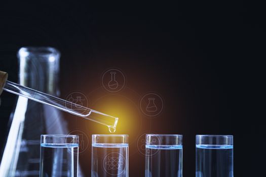 Researcher with glass laboratory chemical test tubes with liquid for analytical , medical, pharmaceutical and scientific research concept.