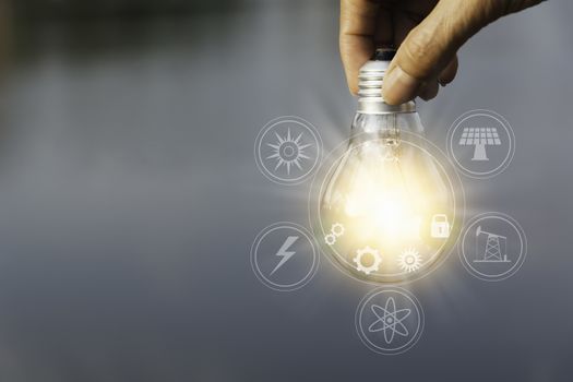Hand holding a light bulb. Innovation and creative concept.