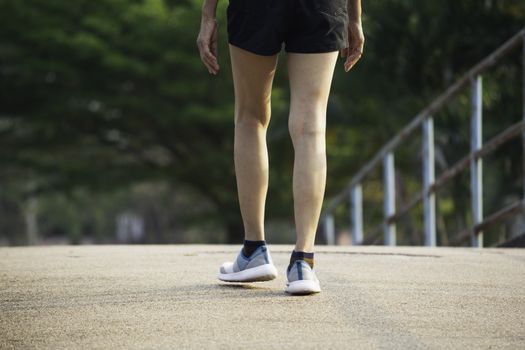 A woman running at the morning for jogging, exercising and healthy lifestyle concept.