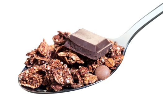 Macro close up of Spoon with mouthful of chocolate muesli. Isolated on white background.