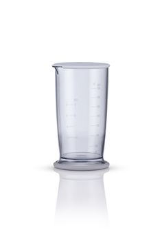 measuring beaker on a white background with reflection. kitchen appliances