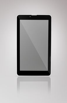 Black a tablet with reflection on a dark background closeup