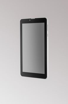 Black a tablet on a dark background closeup