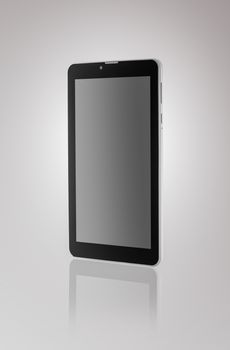 Black a tablet with reflection on a dark background closeup