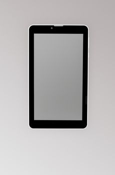 Black a tablet on a dark background closeup