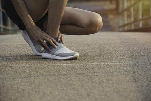 The female clings to a bad leg. The pain in her leg. Healthcare and painful concept.