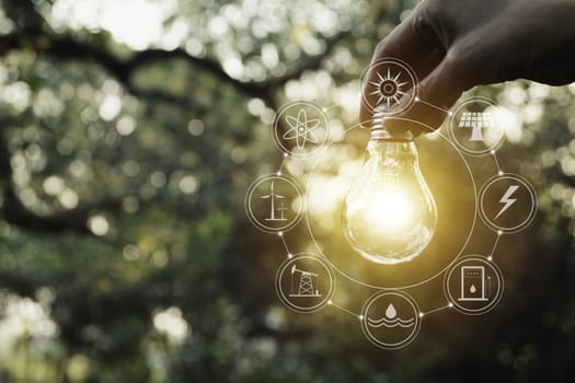 Hand holding a light bulb. Innovation and creative concept.
