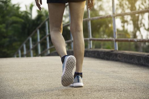 A woman running at the morning for jogging, exercising and healthy lifestyle concept.