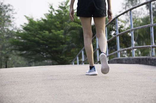 A woman running at the morning for jogging, exercising and healthy lifestyle concept.