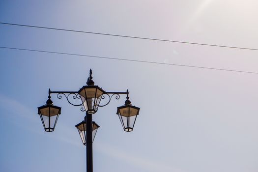 Retro street lamps in Kendal Cumbria UK with blue sky