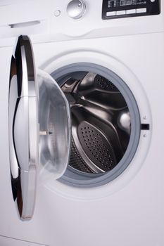 the front part of the modern washing machine with an open door