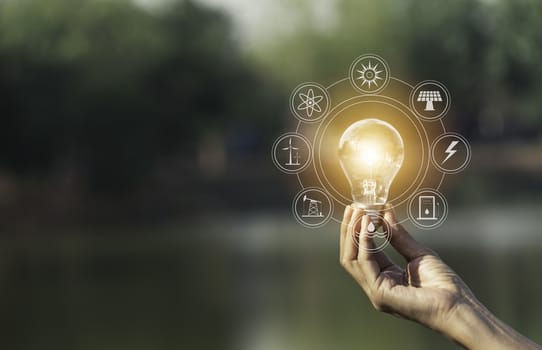 Hand of male holding a light bulb and copy space for accounting, ideas and creative concept.