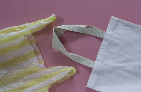 Plastic and white tote bag canvas fabric for save the world and pollution problem concept. 