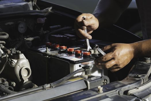 Technician checking engine of car. Auto mechanic checking car engine. Maintenance checking car.